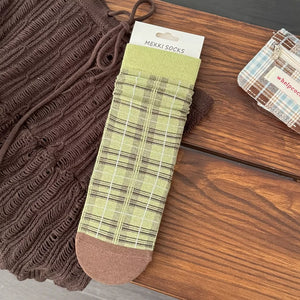 socks in lime green featuring elastic cuff and fitted fit