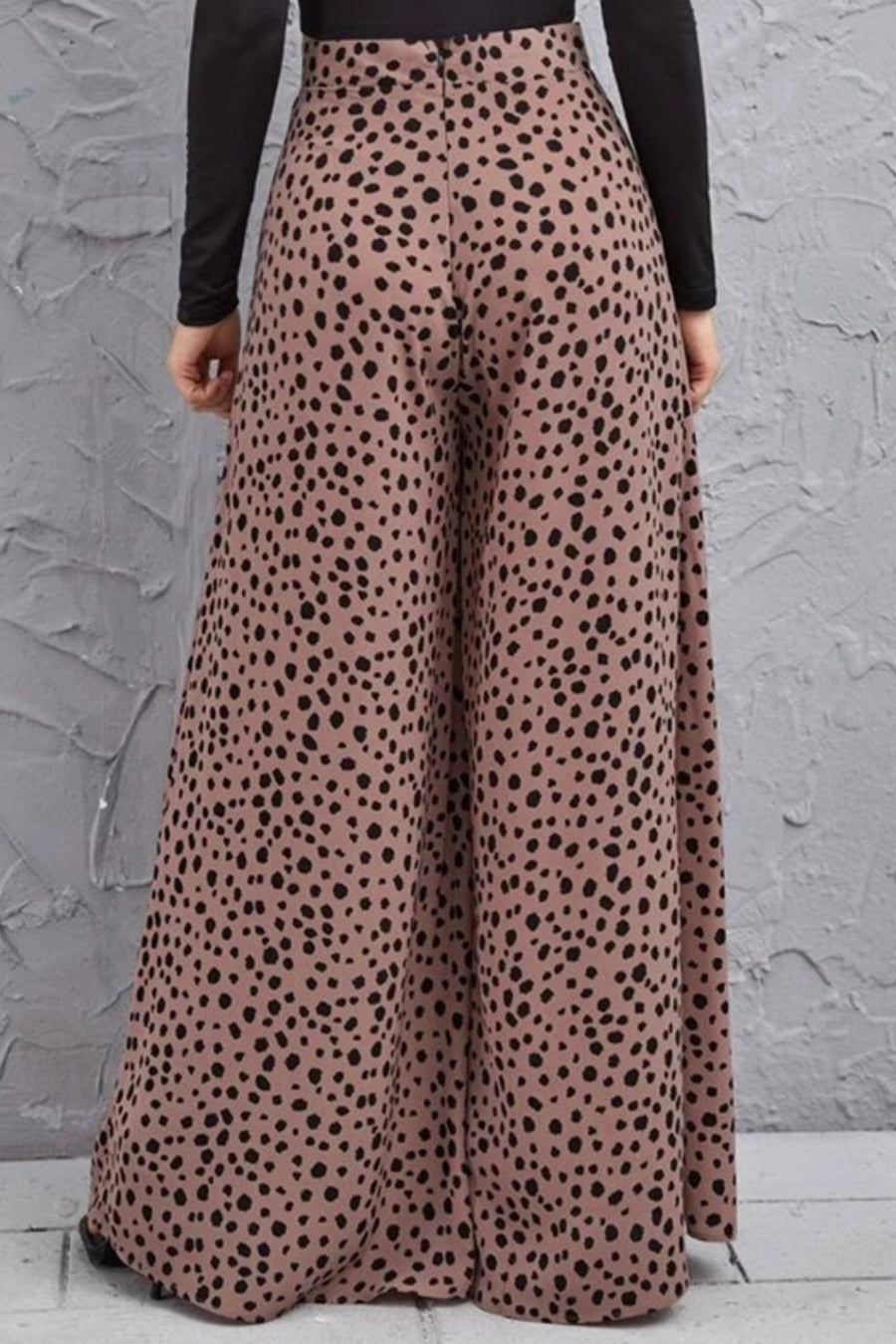 Spotted wide-leg palazzo trousers in dusty pink with a black animal print.