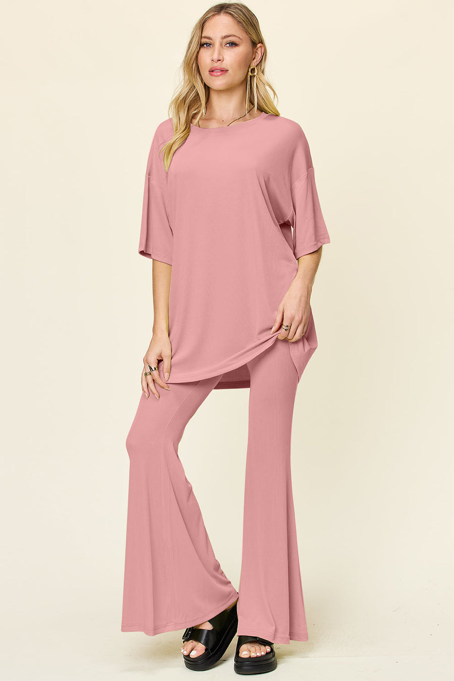 Dusty Pink oversized tee and flare leg pants set with crew neck and short sleeves.