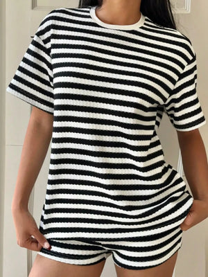 Black and white striped waffle knit loungewear set with crew neck top and shorts.