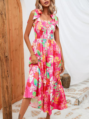 Tropical tie-strap smocked midi dress in strawberry with a floral print and tiered skirt.
