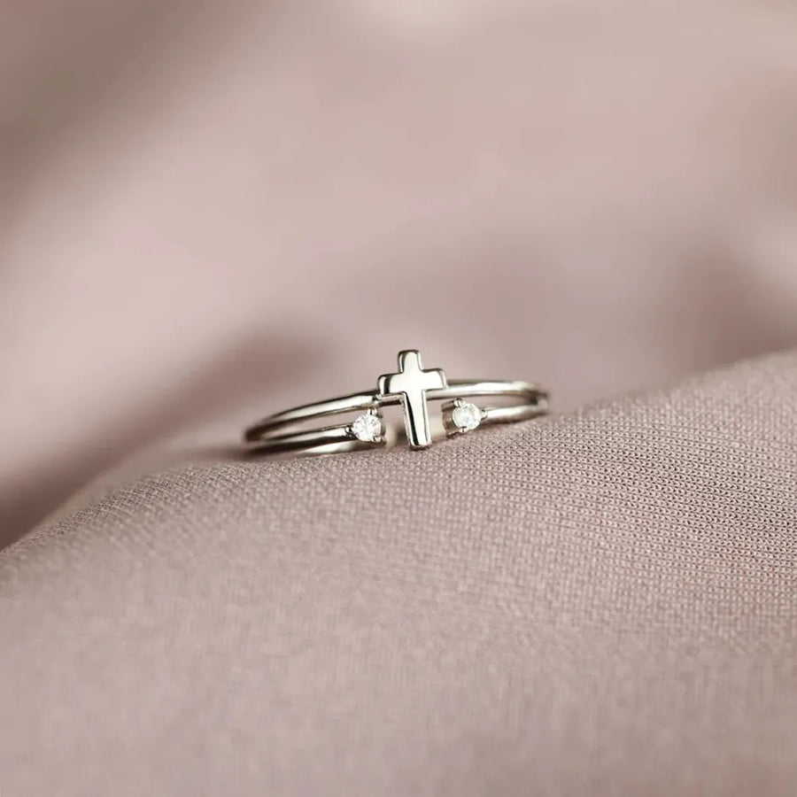 Silver double band ring with a cross and two crystals.