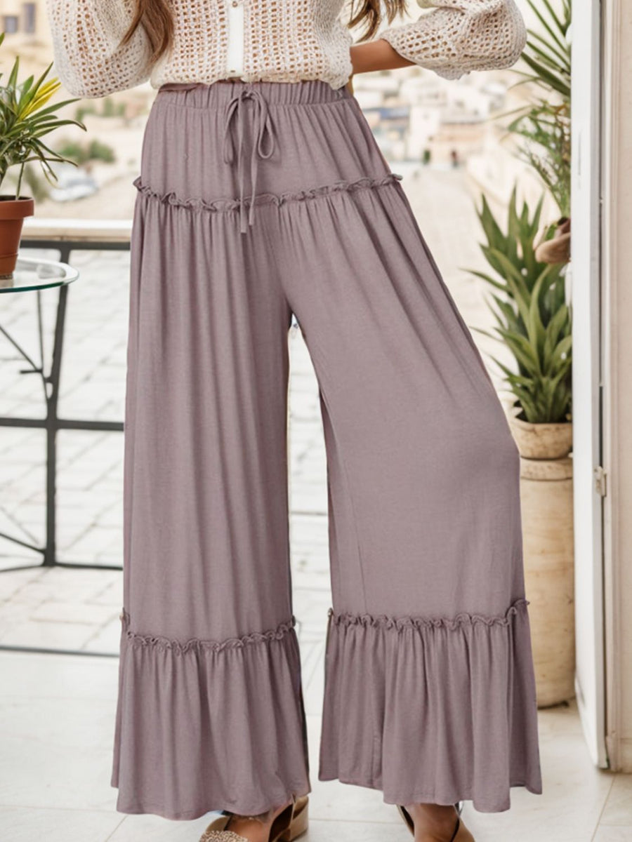 Mauve wide-leg pants with ruffle trim and drawstring waist