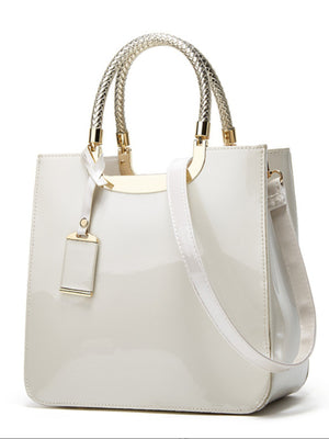 handbag in White with metallic handle and medium