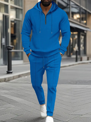 Blue textured quarter-zip hoodie and matching lounge pants set with drawstring details.