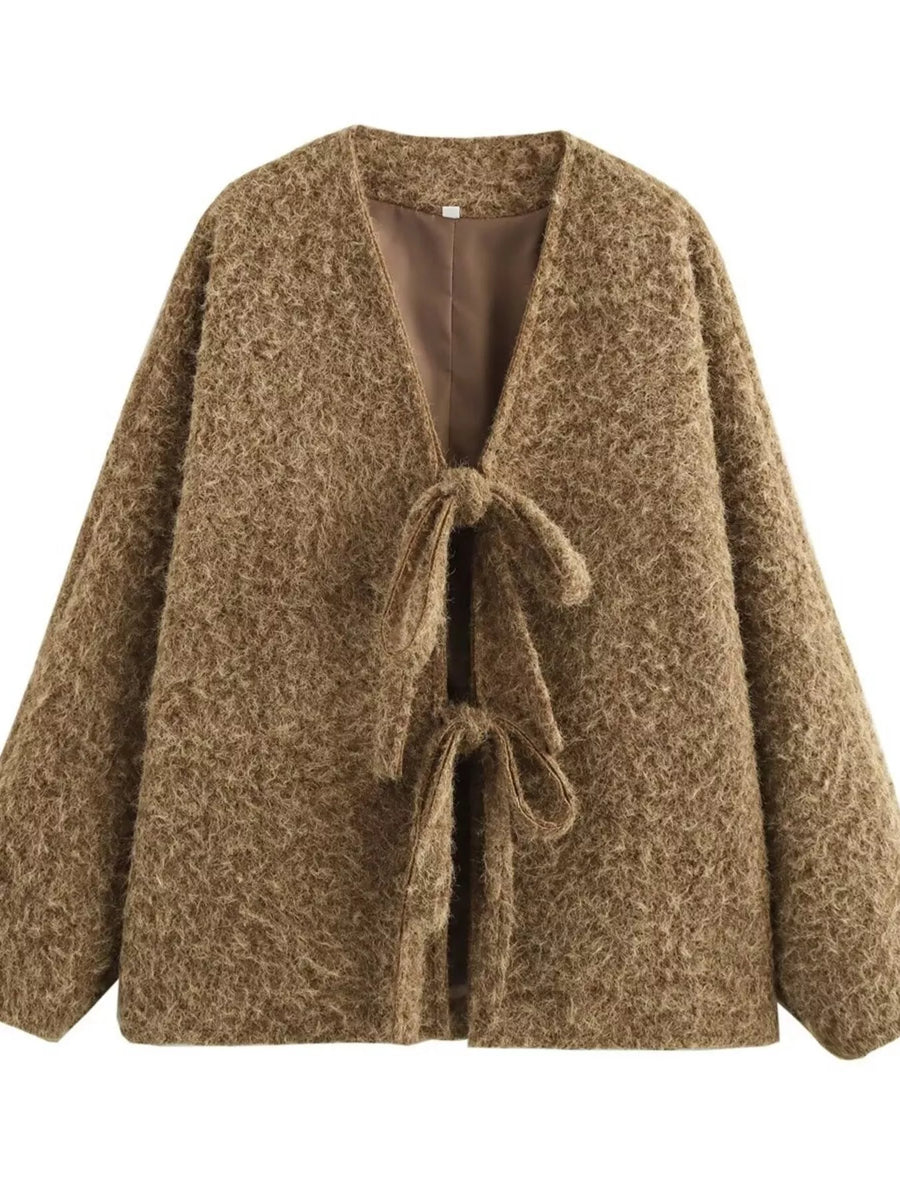 Textured knit tie-front cardigan in dark brown with a cozy, open front and tie closures.
