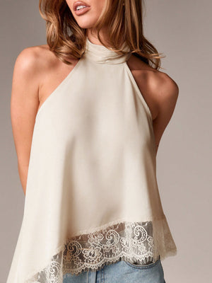 Elegant beige camisole with lace trim and halter neckline