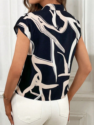 Black abstract print cap-sleeve blouse with tie-neck detail.