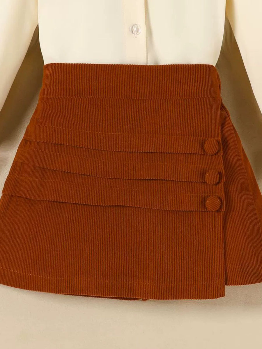 Toddler brown corduroy skort with button detail and tiered pleats.
