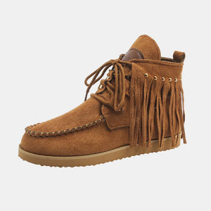 Brown suede fringed moc-toe ankle boots with lace-up closure.