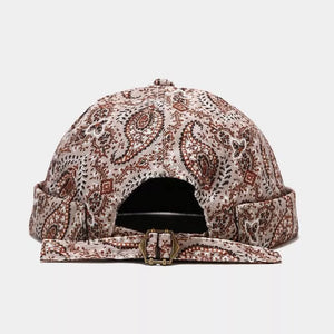 hat in beige featuring adjustable strap and fitted fit
