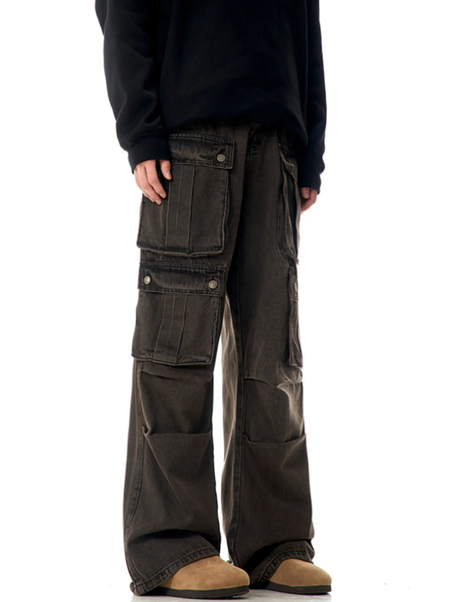 Relaxed fit cargo pants in washed brown with multiple flap pockets and button closures.