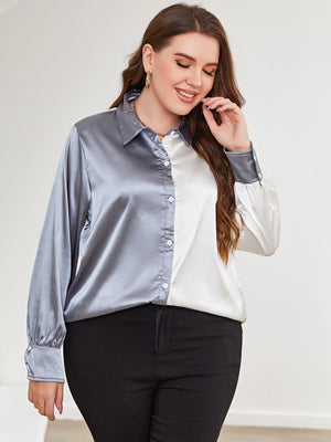 Satin split-tone button-down blouse in light blue and white with button cuffs.