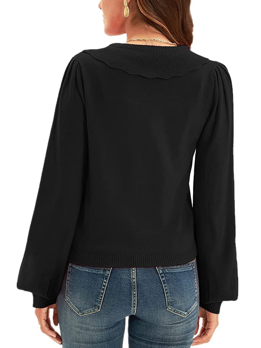 Black knit cardigan with scalloped collar and puff sleeves
