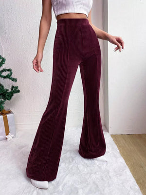 Burgundy corduroy maternity flare pants with high waist and bell bottoms.