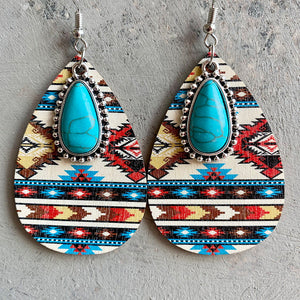 Southwestern print teardrop earrings with turquoise stones and alloy trim.