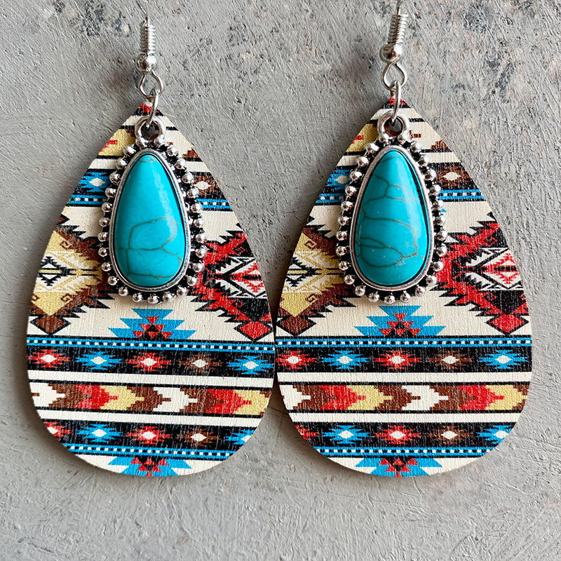 Southwestern print teardrop earrings with turquoise stones and alloy trim.