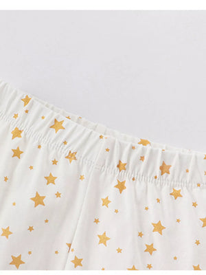 White cotton pajama pants with gold stars and elastic waistband