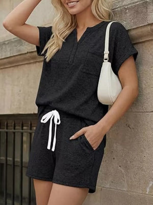Black relaxed two-piece set with pocketed top and drawstring shorts