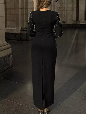 100% polyester Care instructions: Machine wash cold maxi dress in Black with fitted silhouette