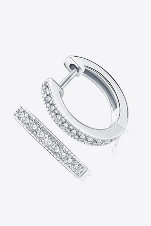 Silver pave-set huggie hoop earrings with sparkling stones.