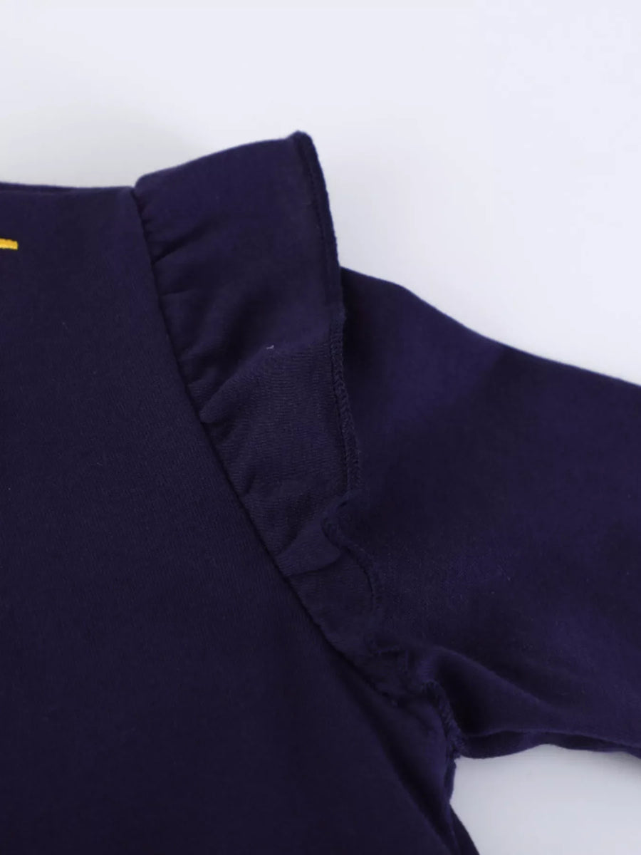 Dark navy baby dress with ruffled shoulder detail and long sleeves.
