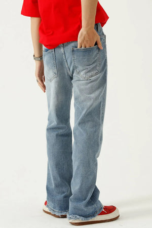 Seam detail flare jeans in medium wash denim with frayed hems.