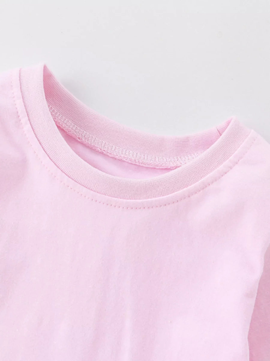 Blush pink cotton pajama top with a crew neck and ribbed collar detail.