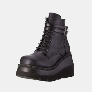 Black platform lace-up booties with double buckle straps and a thick sole.