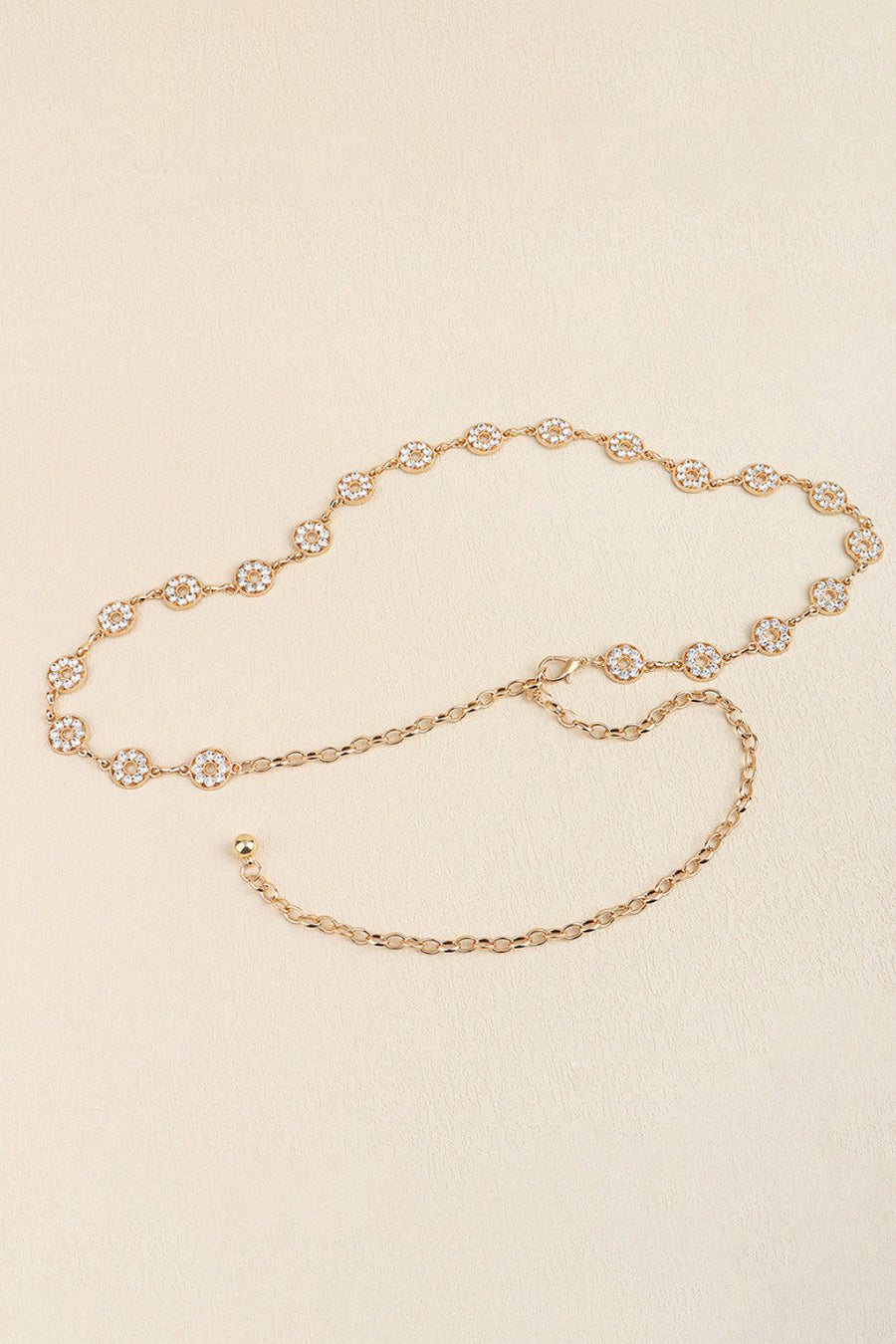 Gold celestial chainmail waist belt with crystal-embellished circular charms and adjustable chain.