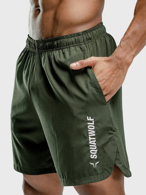 Performance shorts in army green with split hem and white logo detail