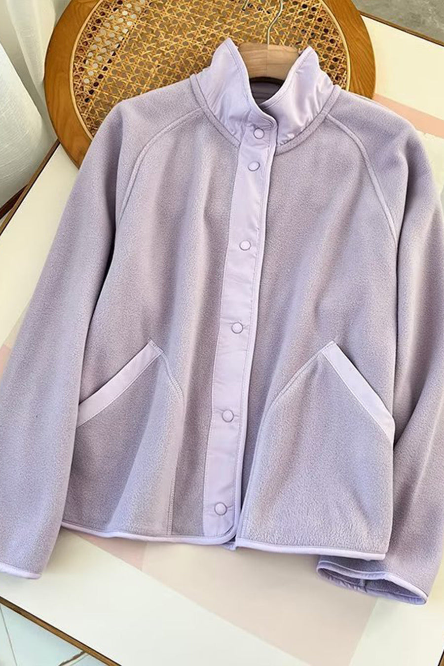 Pink Purple fleece bomber jacket with contrast trim and snap button closure.