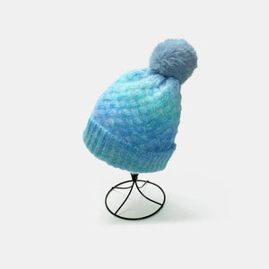 Pastel blue ombre knit beanie with textured pattern and pom.