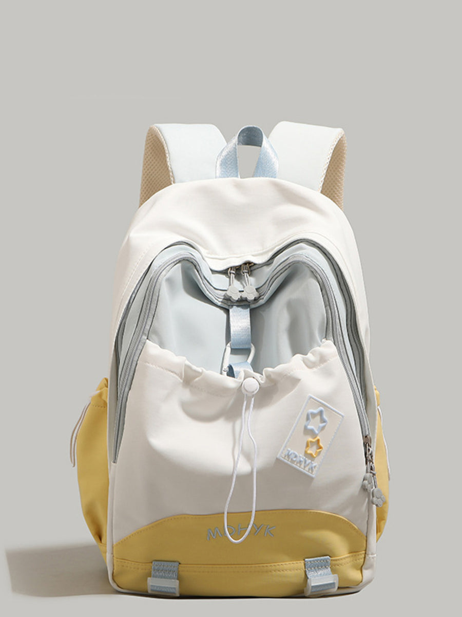 Nylon drawstring backpack with multiple pockets, featuring yellow and cream color blocking and star patches.