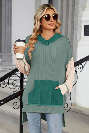 Green ribbed v-neck hoodie with colorblock sleeves and a front pocket