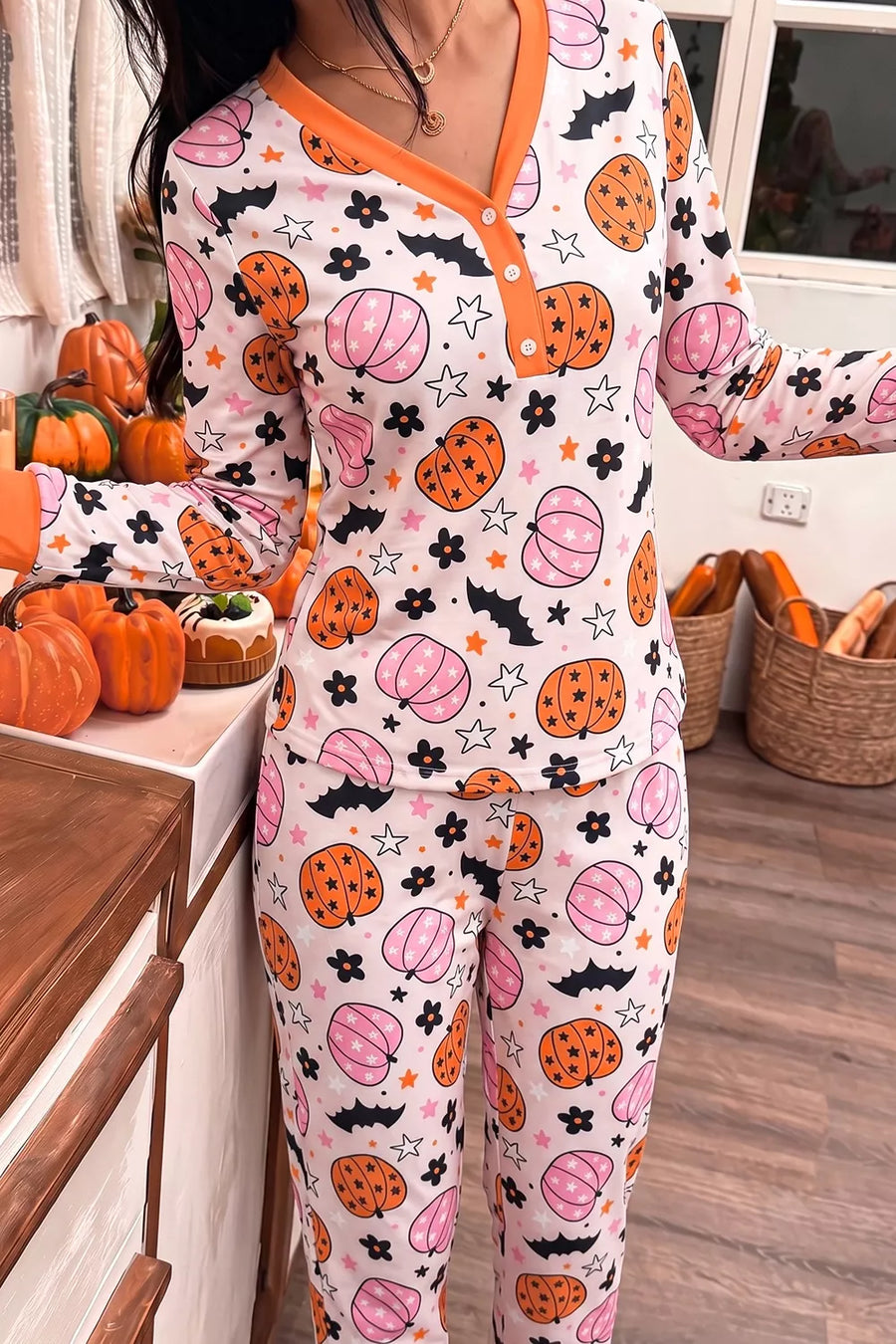 orange pajama set featuring buttoned placket and novelty print