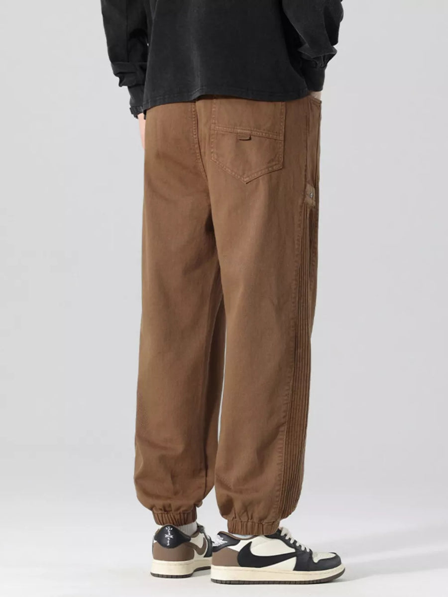 Oversized coffee cargo joggers with drawstring and ribbed side detail.