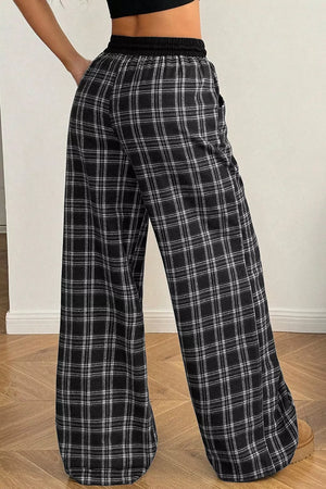 97% polyester, 3% elastane Care instructions: Machine wash cold wide-leg pants in Black with loose silhouette