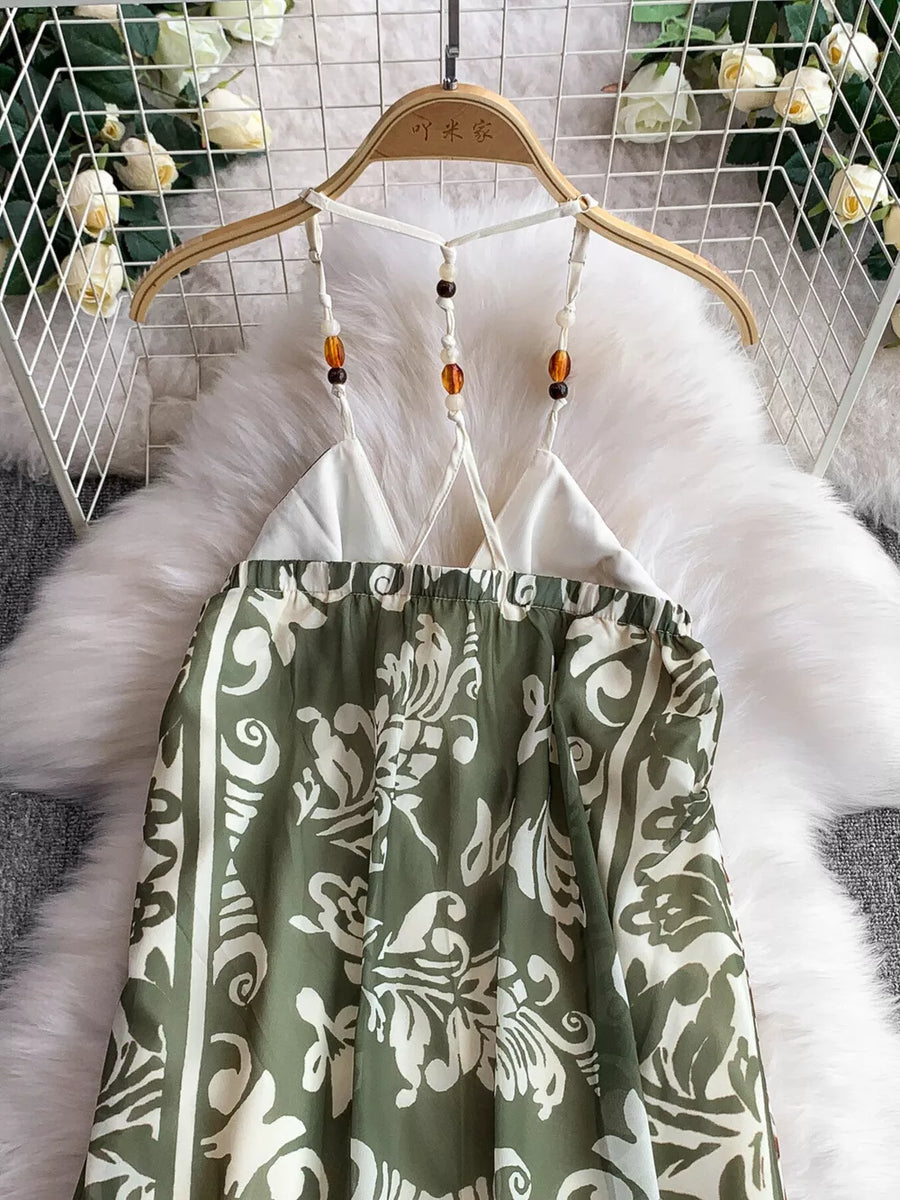 Dual-pattern V-neck cami dress with beaded straps and a green floral print.