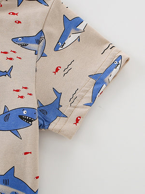 Toddler crew neck t-shirt in beige with blue shark and red fish print.