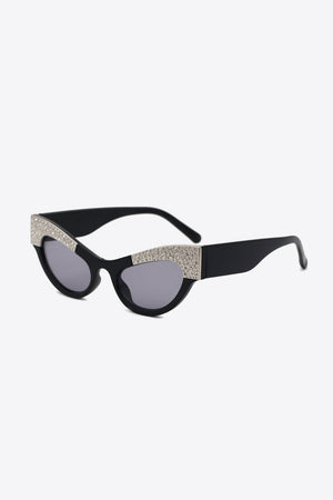 Black cat-eye sunglasses with crystal embellishments on acetate frames