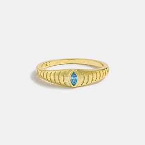 Gold grooved band ring with aquamarine eye stone