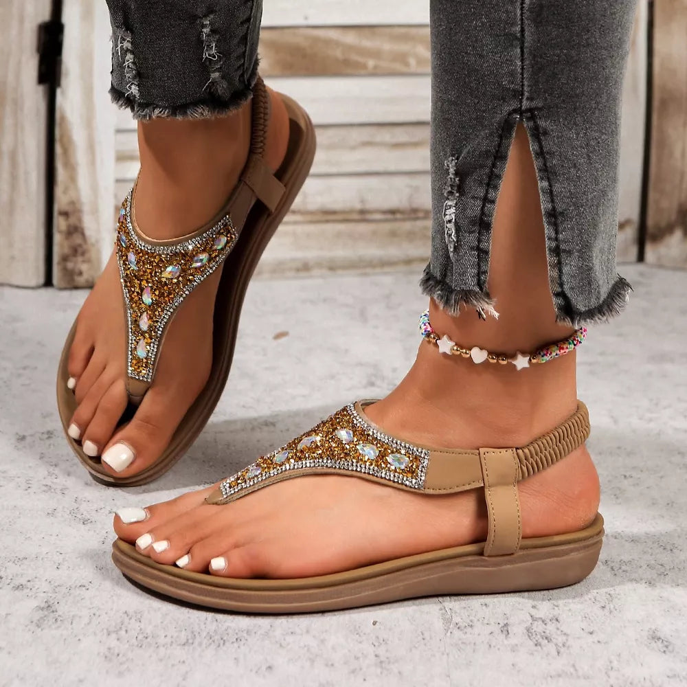 Brown rhinestone-embellished toe post sandals with elastic heel strap and comfortable sole.