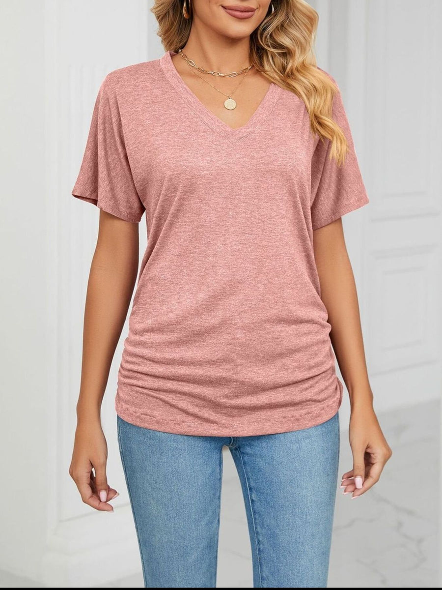 Pink relaxed V-neck short sleeve t-shirt with ruched sides.