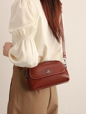 PU Leather Crossbody Bag With Metal Emblem in cognac with metal emblem