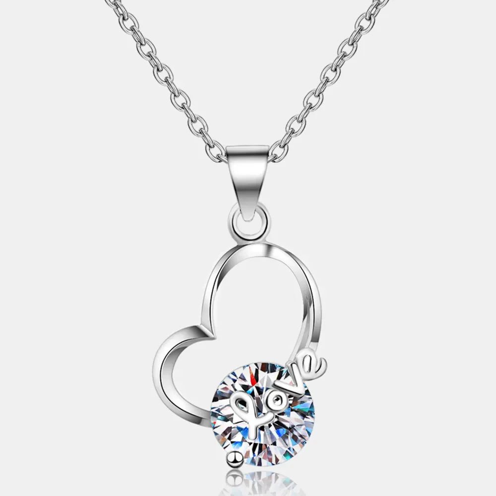 Silver heart halo pendant necklace with clear crystal and "love" charm
