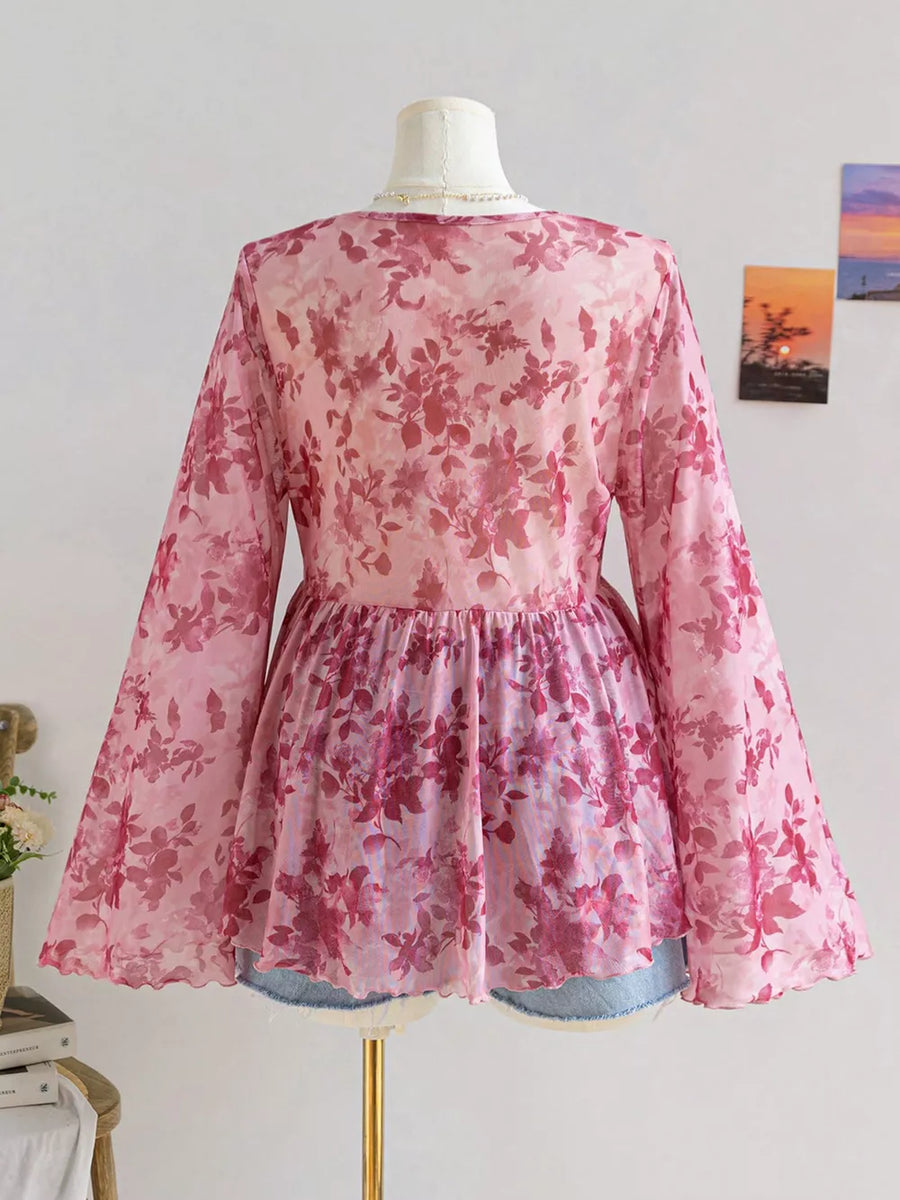 Pink floral chiffon blouse with bell sleeves and scalloped hem