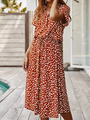 Scarlet polka dot midi dress with drawstring waist and short sleeves.