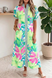Charming floral midi dress with puff sleeves, button front, and green stripe detail.