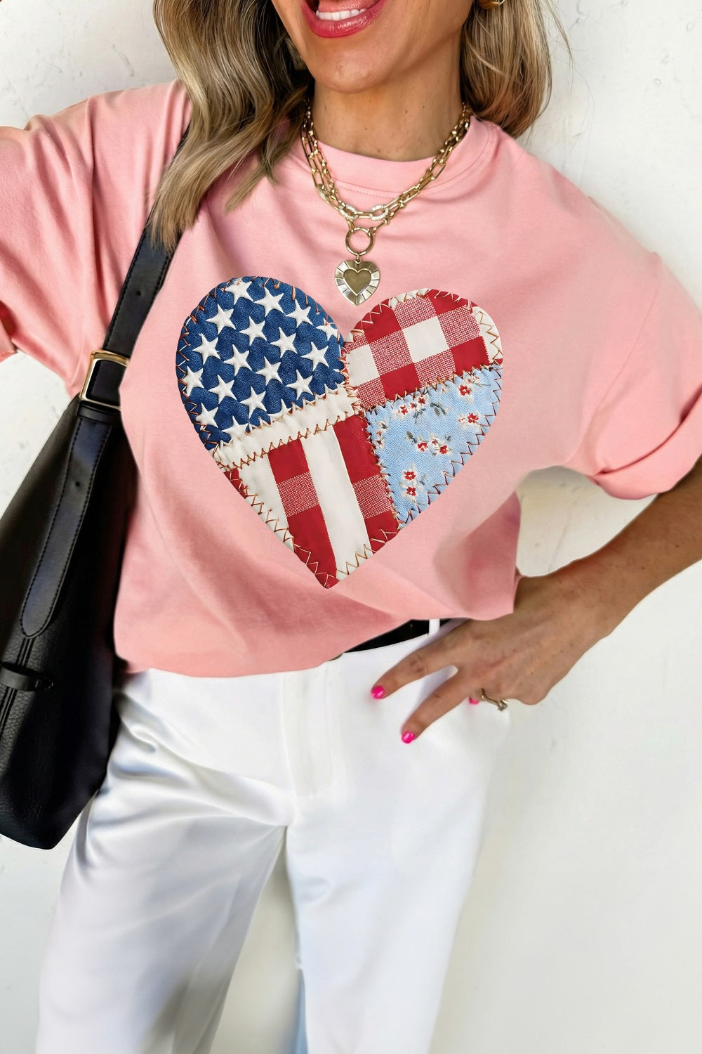 Pink t-shirt with a patriotic patchwork heart graphic, crew neck, short sleeves.